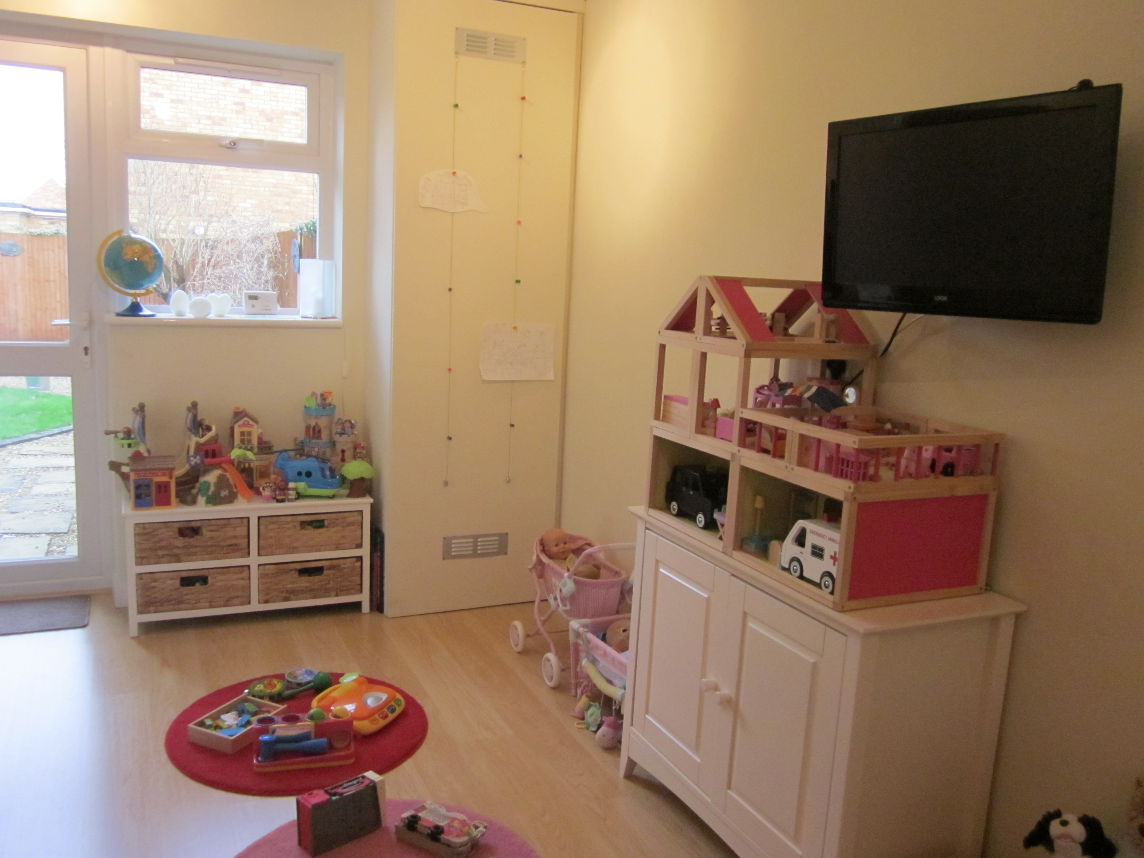 The new play area with door leading to garage.